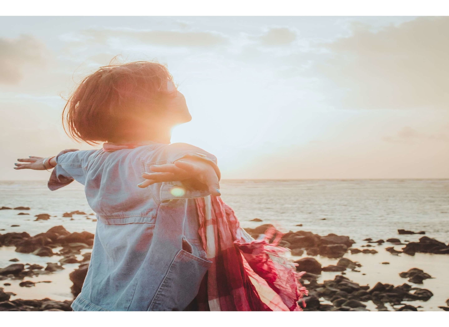 girl-standing-in-sun-on-beach